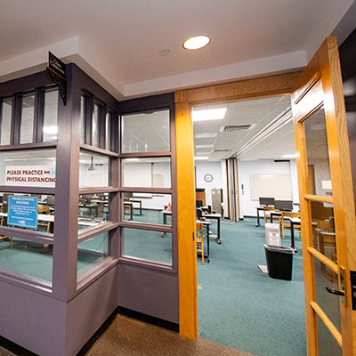 View of a classroom through an open door.